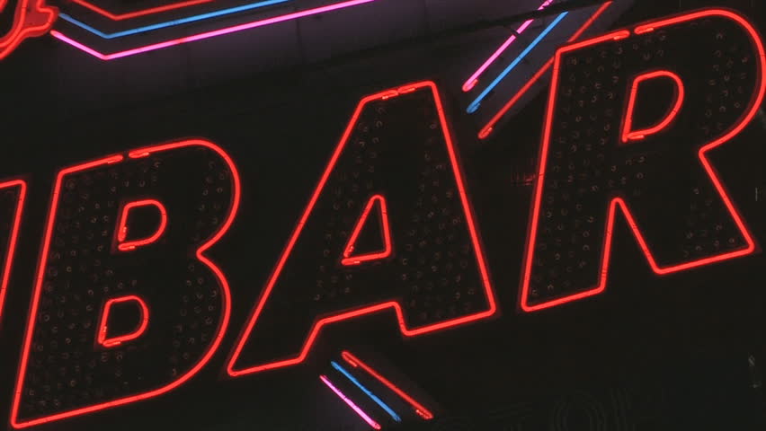 BAR sign. Red and white flashing sign reading "BAR". Neon and lightbulbs. Shot with Canon XH-A1s. 