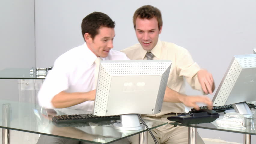 Cheerful businessmen celebrating a success at work