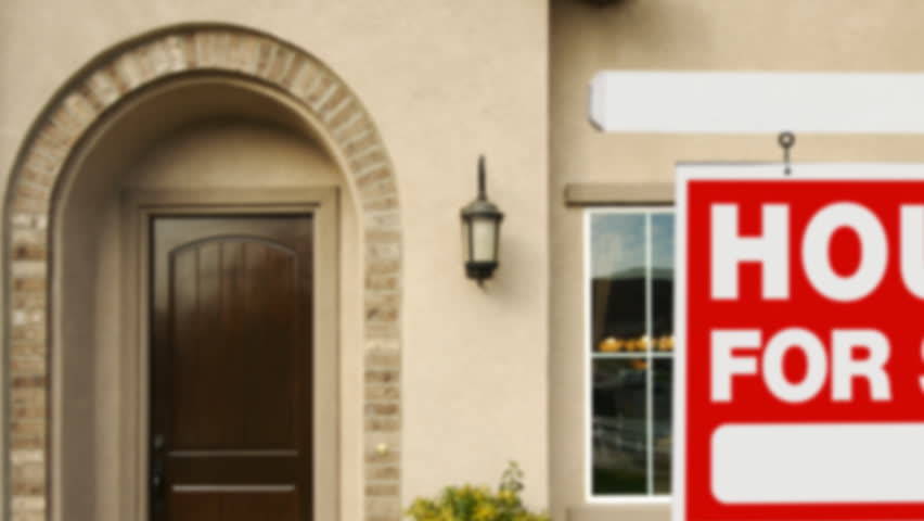 Panning Home For Sale Sign and House.