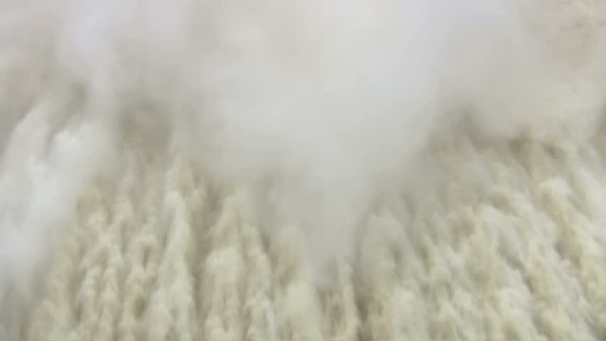High angle of water flowing thru dam