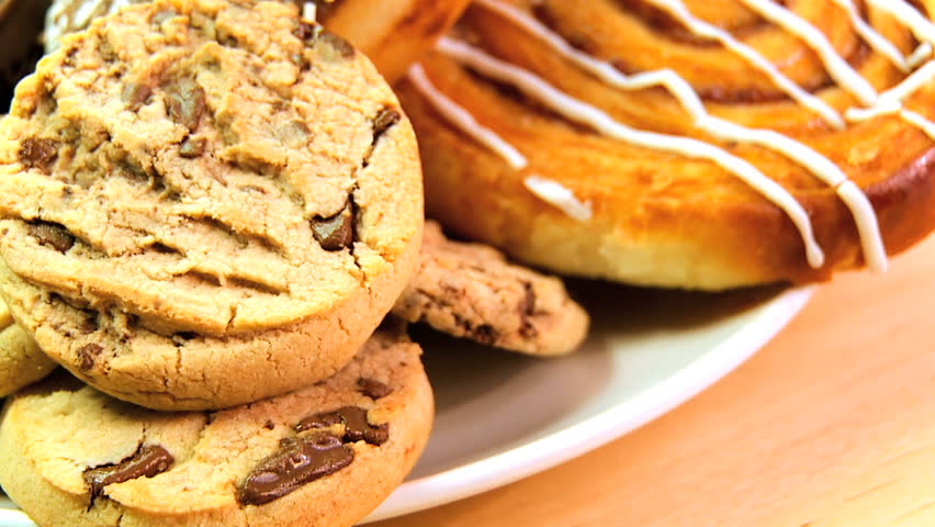 Unhealthy selection of indulgent high calorie sweet & sticky cakes & cookies
