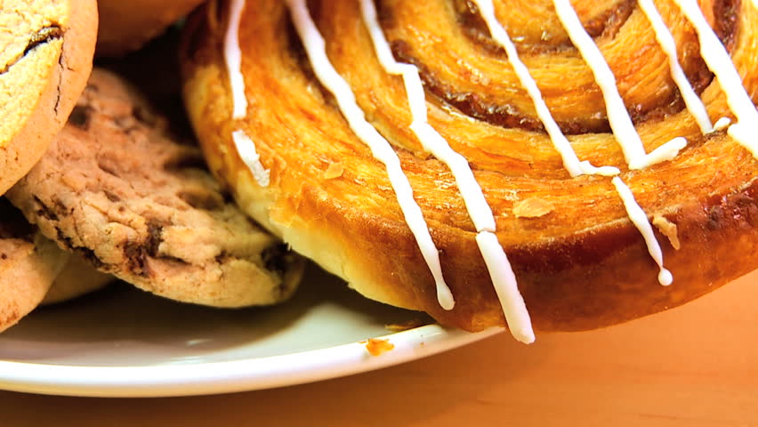 Unhealthy selection of indulgent high calorie sweet & sticky cakes & cookies