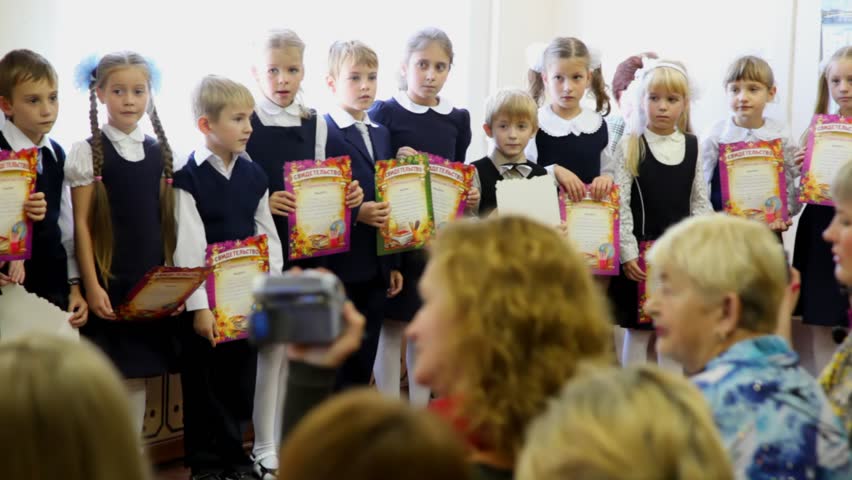 MOSCOW - OCTOBER 1: Children stand in row and sing song together at dedication meeting in first-graders of school number 1349 on October 1, 2009, Moscow. In Moscow there are more than 1500 schools. 