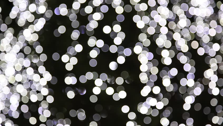 Blurred Christmas ornaments on tree