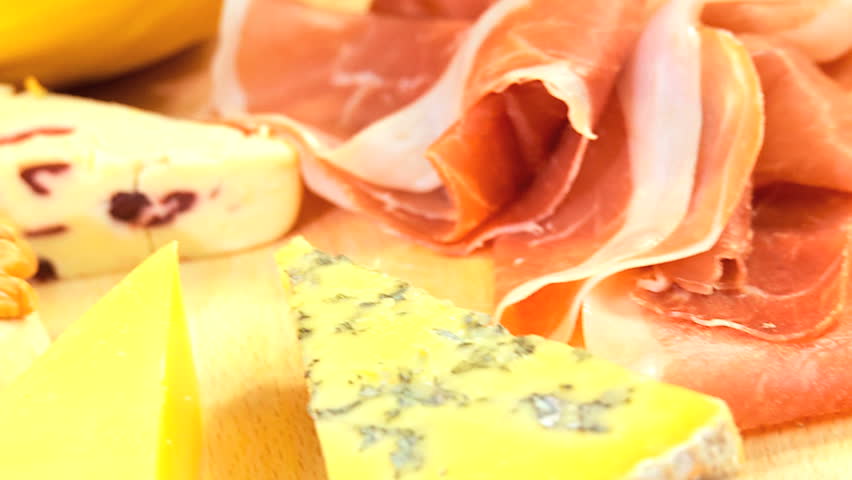 Savoury parma ham served with luxury cheeses, melon ball nest & wholegrain bread