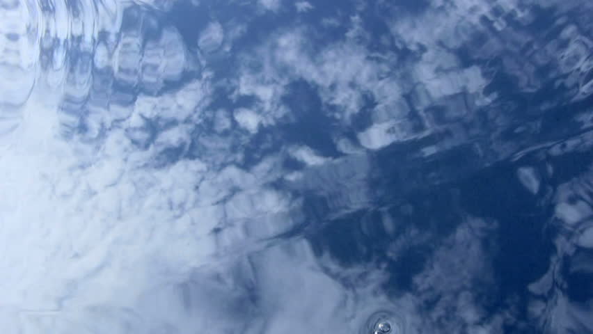 The flows of clear water on background  the cloudy sky