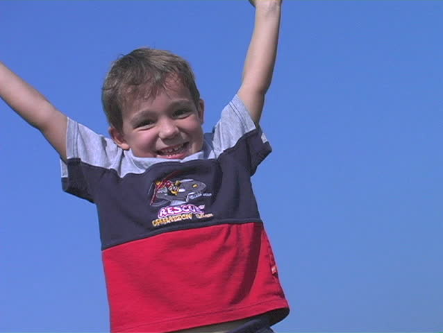 Young boy kicking a soccer ball then CHEERING - low camera angle