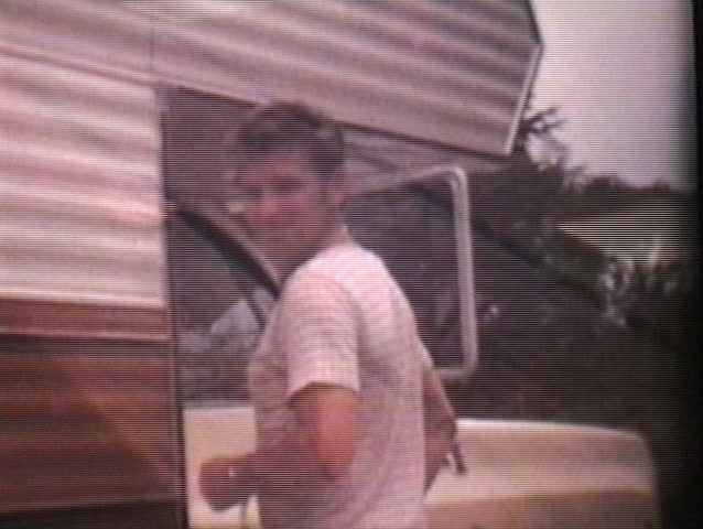 A family enjoys spending time together camping in their home-made camper on their summer holidays.