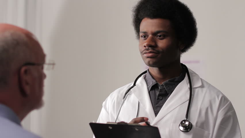 African American male doctor with patient