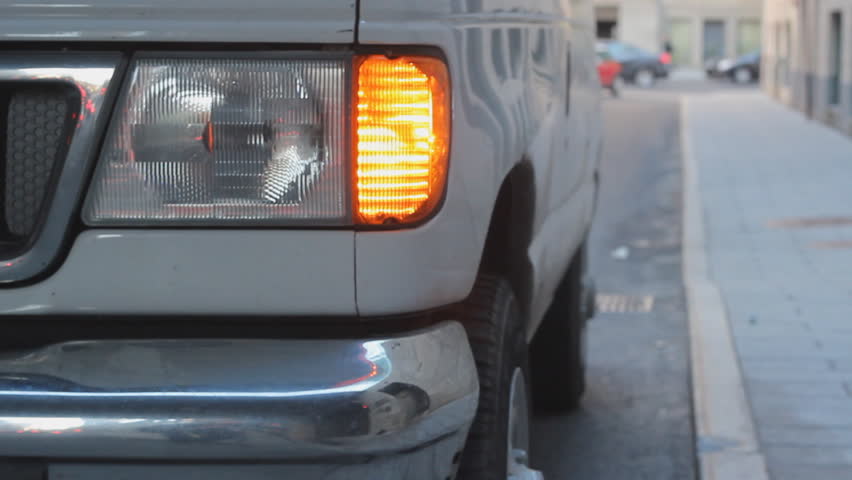 Delivery van. Van making a delivery with flashing hazard lights. 