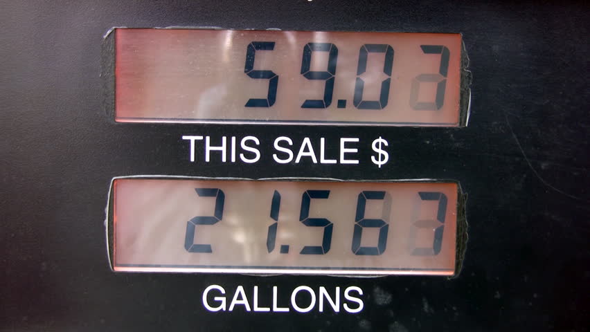 Video of a gas pump gallons and price display going up to 91 dollars. High price of diesel and gas. Profit to oil companies. Pollution and aid in global warming. 