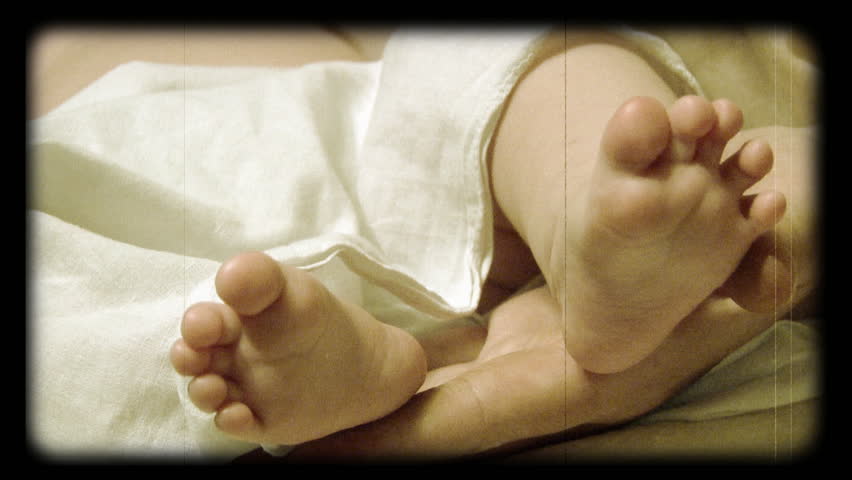 newborn baby feet stylized at reel movie