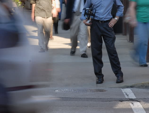 City commuters at crosswalk in rush hour