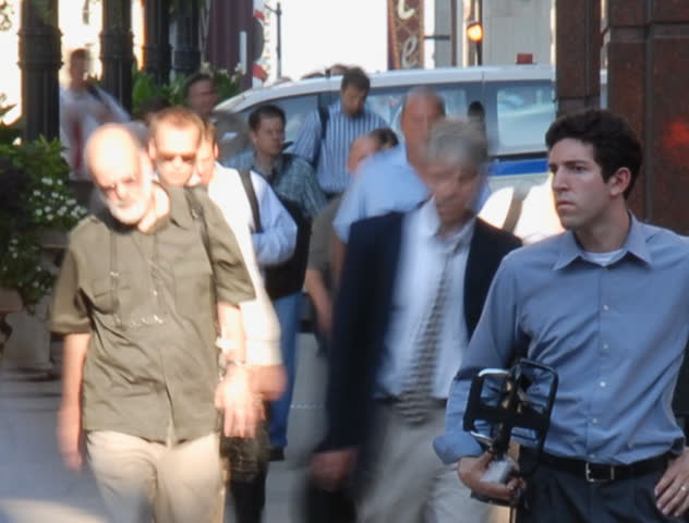 City commuters at crosswalk in rush hour