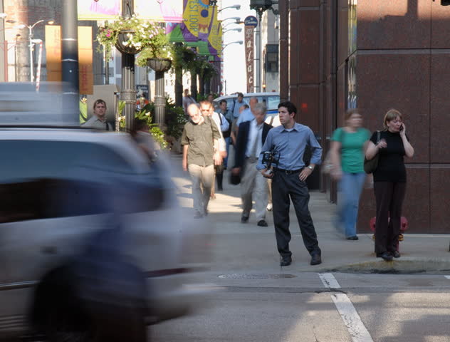 City commuters at crosswalk in rush hour