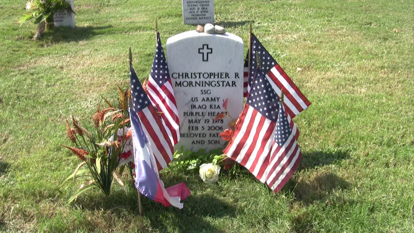 Video zoom headstone Ft Sam Houston Veterans Cemetery San Antonio Texas. Hero and warrior, members of Army military killed in action, KIA, in Iraq. Marble headstone with inscription father and son.
