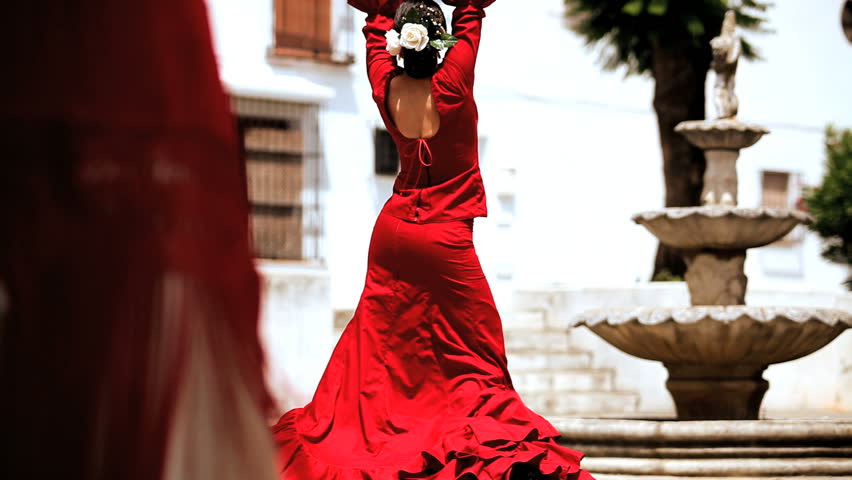 Traditional flamenco dancing being performed by two ladies in town square in Seville, Spain 