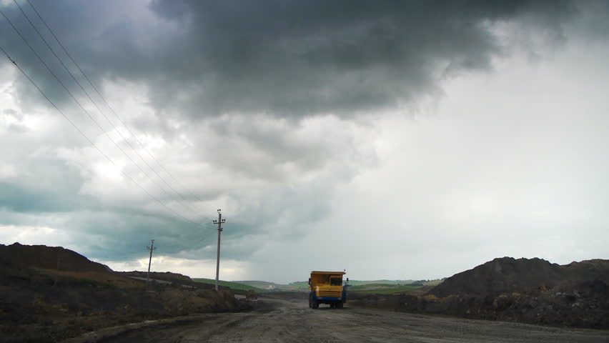 Off-road dump truck in the open pit mine
