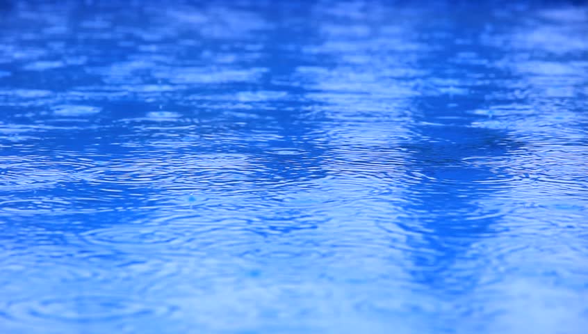 Rain drops on water level