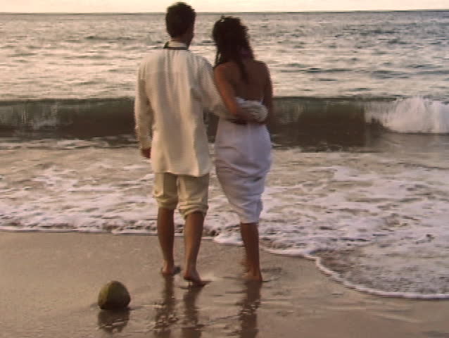 Lovers play by ocean