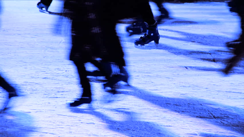 Winter outdoor ice skating with crowds of people in close-up & silhouette
