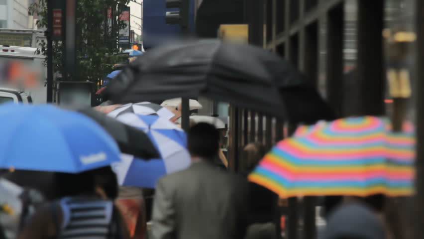 Defocused crowd - people with umbrellas, New York City 