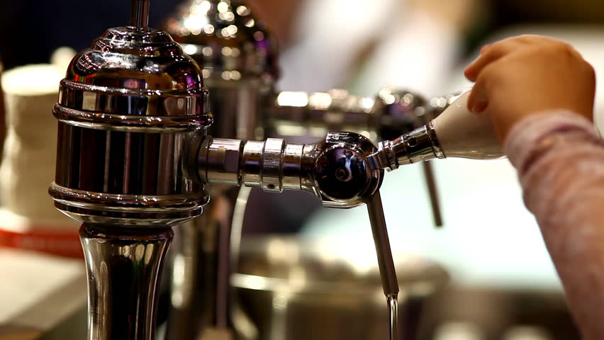 Pour beer in bar 
