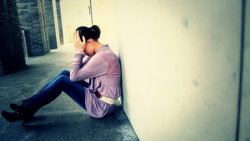 Sad woman sitting outdoor, tracking shot