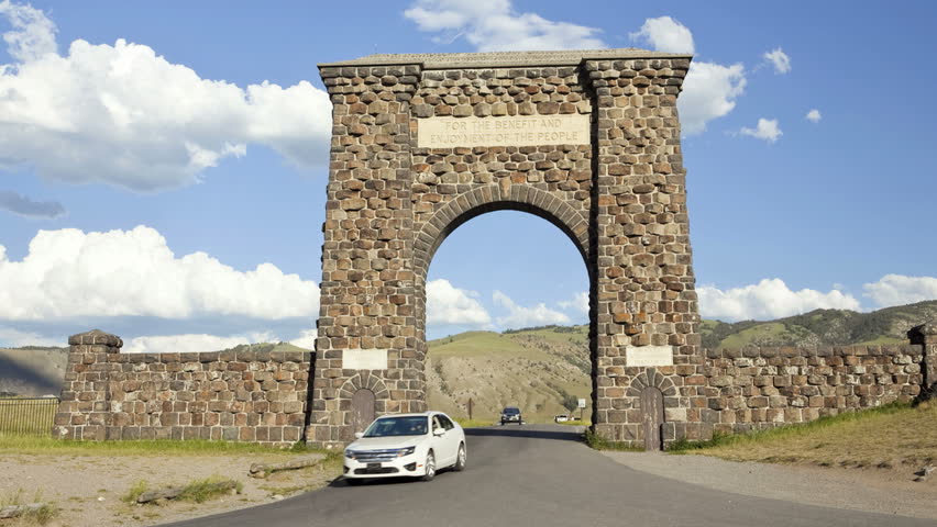Time lapse shot of the historic stone archway entrance in Yellowstone National Park