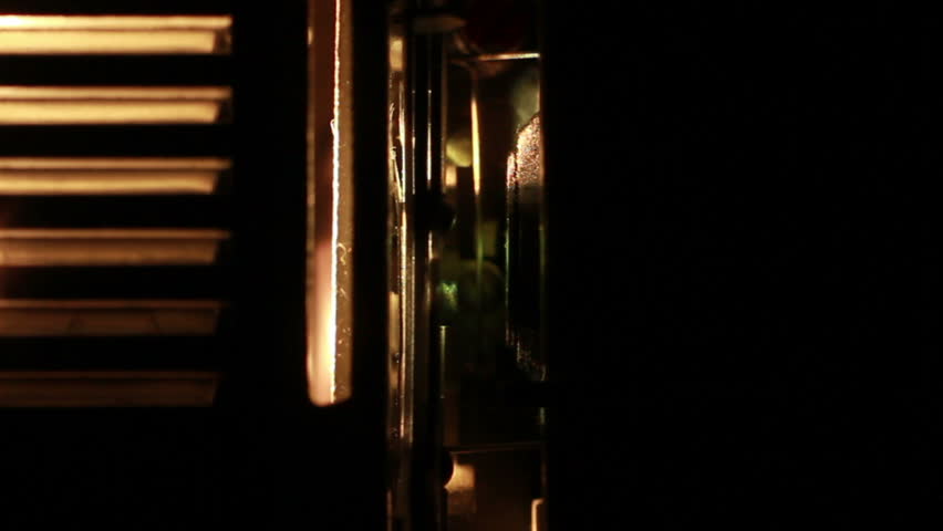 Vintage film projector showing film, multiple macro shots.