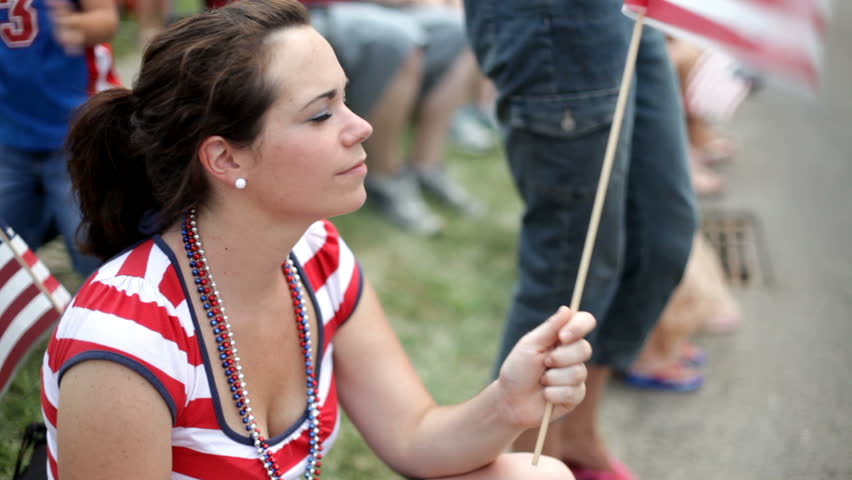 Girl Waving Flag at July 4th Parade