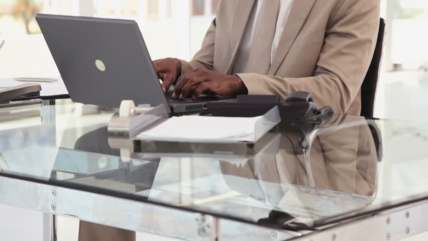 Businessman Using a Phone at the Office