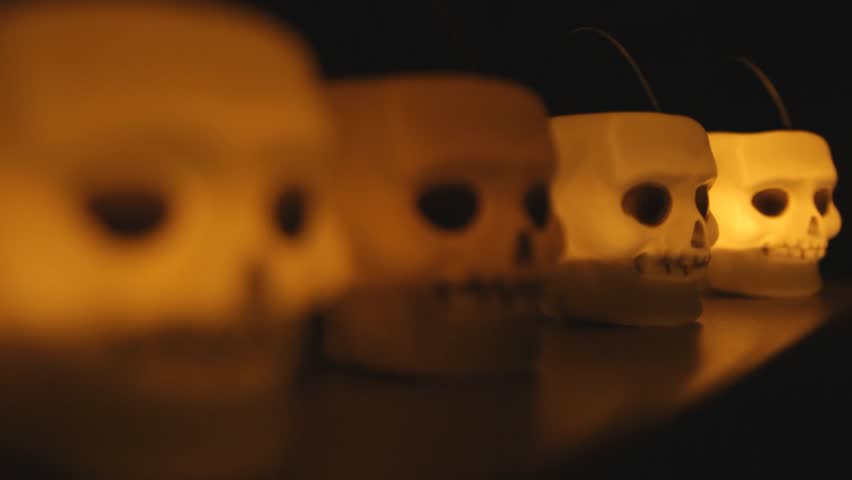Glowing skull candle from side