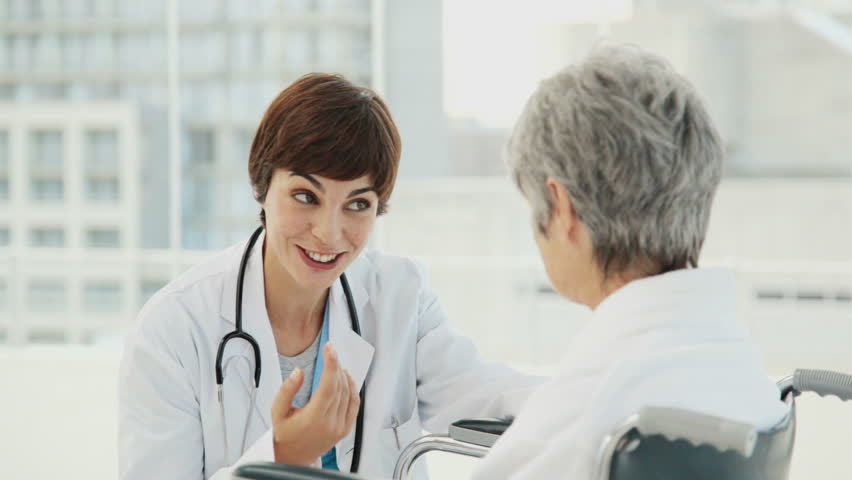 Doctor Consults with her Elderly Patient