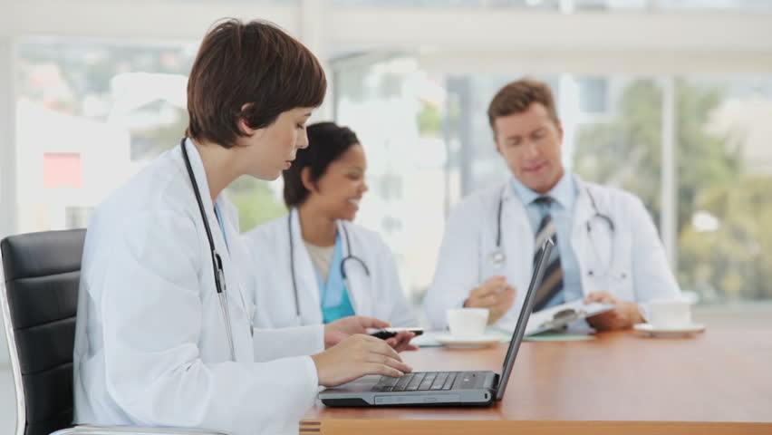 Female Doctor Multitasking on a Break