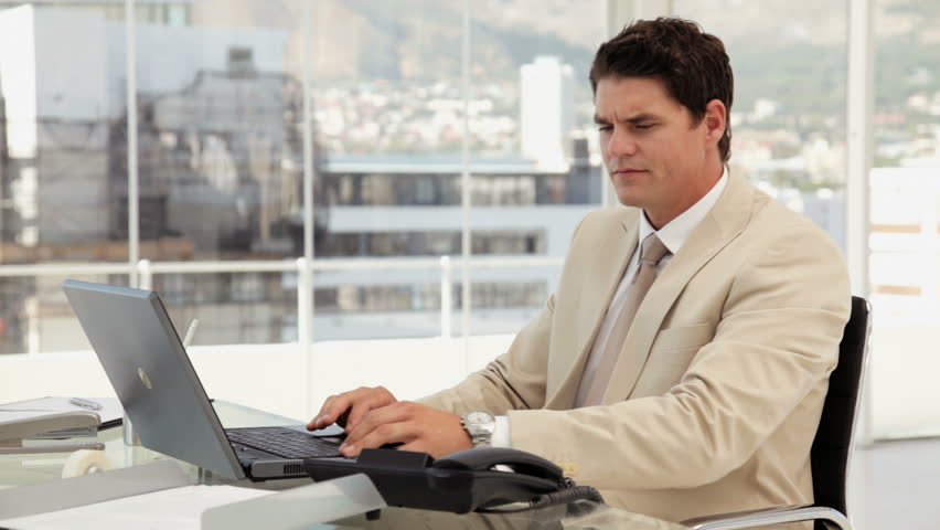 Businessman Talking on the Phone at the Office