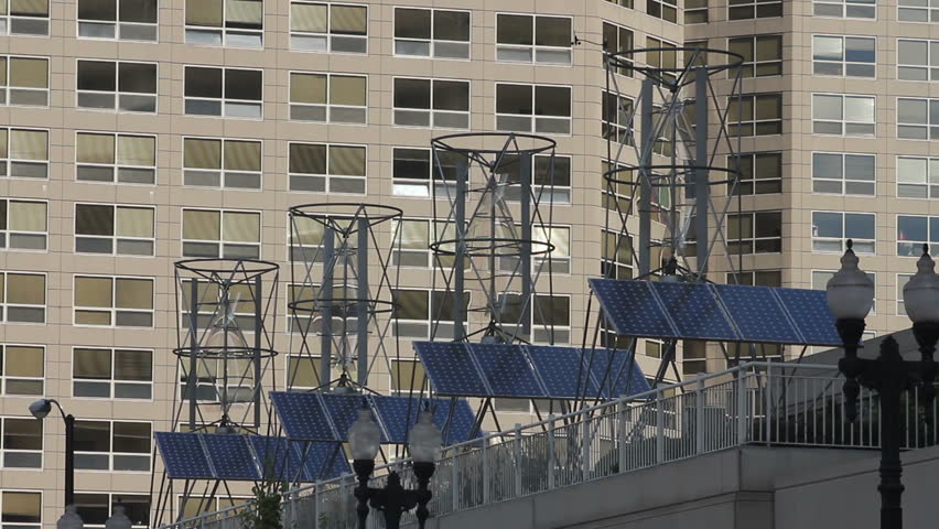 Wind and solar energy combined atop a city rooftop 