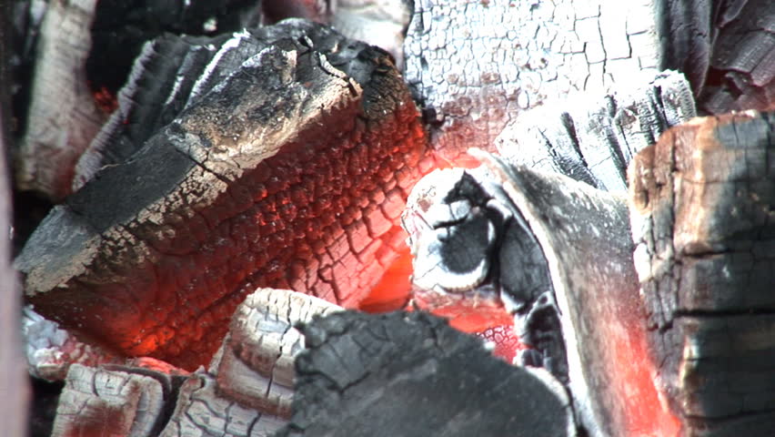 Coals burning in a BBQ, closeup