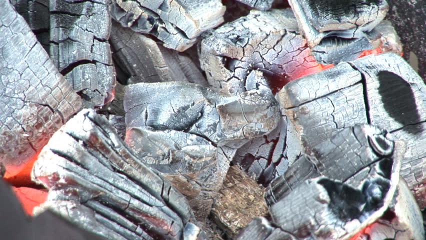 Coals burning in a BBQ, closeup