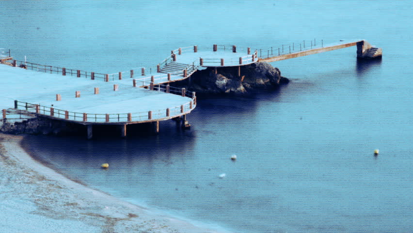 shot of a pier and sea in marseille, as it gets dark 