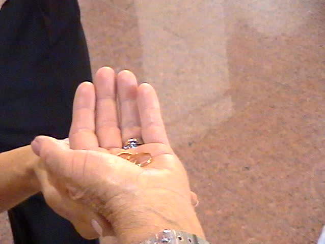 Priest blessing wedding rings.