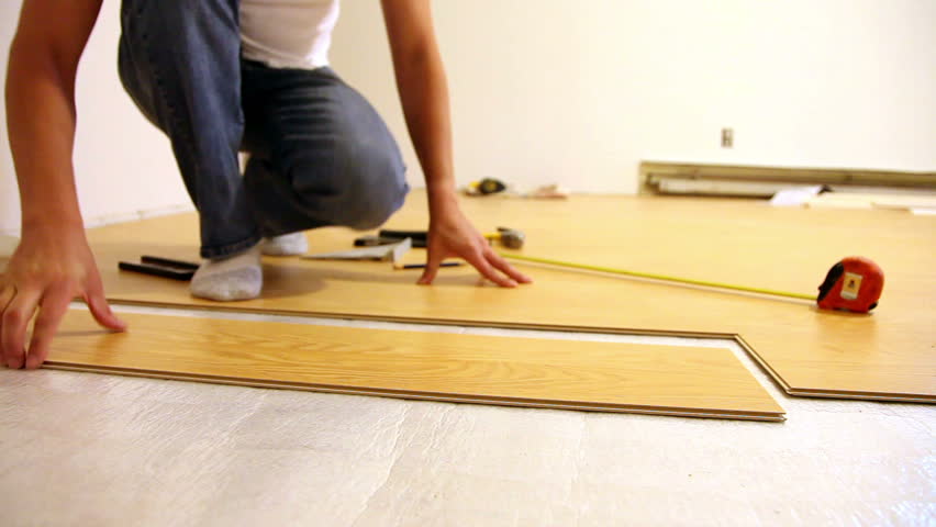 Man Installing Laminate Flooring