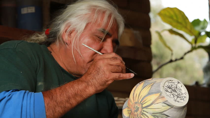 An artist at work in his ceramic studio. 