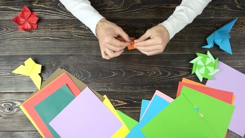 Man Folding An Origami Fox Hands Fold Animal From Paper Top View Origami Project Ideas
