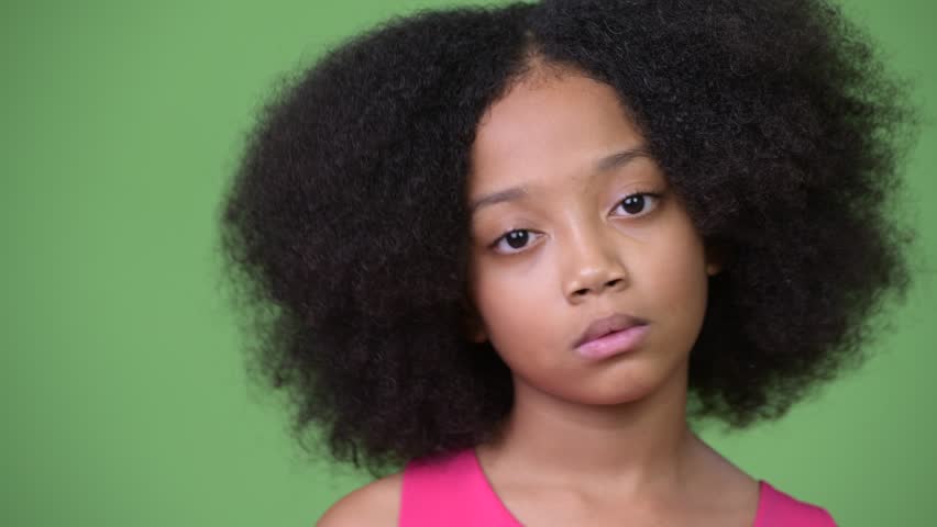 Young Cute African Girl With Afro Hair Covering Ears As Three Wise