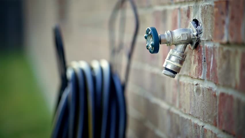 Connecting A Water Hose To Stock Footage Video 100 Royalty Free