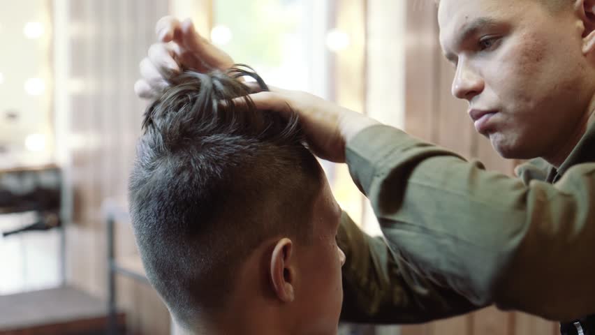 4k00 08young Men In The Hairdresser Lay Their Hair After A Haircut