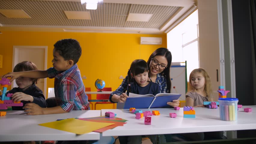 Positive Mixed Race Daycare Teacher Stock Footage Video 100 Royalty Free 1021240801 Shutterstock - 