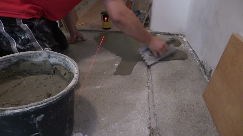 Stock video of Laying Ceramic Floor Tiles - Man Hand Spreading ... Stock video of Laying Ceramic Floor Tiles - Man Hand Spreading ...