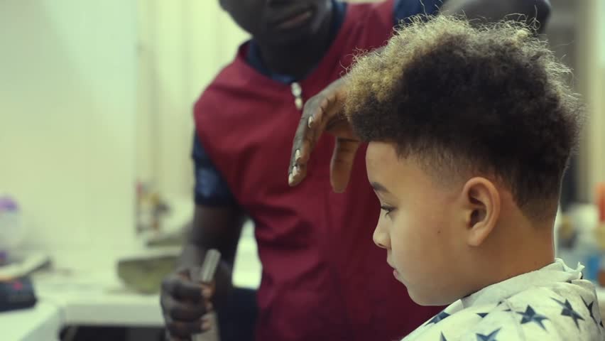 Hd00 12boy In The African Barbershop Cute Mixed Boy Makes A